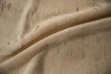 Reverse view of the vintage Oushak rug, showing the hand-knotted beige foundation.