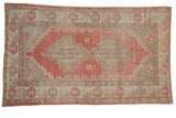 Distressed vintage Oushak rug, faded ruby red and muted silver double medallion design.