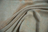 Soft, draped vintage Oushak pile showing even wear to the knot heads and pebbled texture.