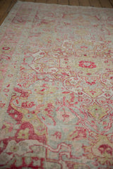 Close-up of distressed Sivas rug: even wear, faint foundation, raspberry, mint vine patterns.