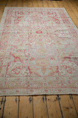 Vintage Distressed Sivas Carpet, showing faded raspberry border, low pile texture, and fringe.