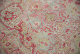 Distressed Sivas carpet with raspberry, mint blue floral vinery and visible foundation wear.