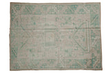 Distressed Vintage Oushak rug, faded seafoam geometric medallion, ivory field, 4'x5'3