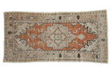 Distressed vintage Oushak rug, burnt orange medallion, ivory field, playful floral border. 2'10