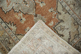 Distressed vintage Oushak rug pile with even wear, revealing its hand-knotted woven foundation.