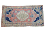 Distressed Oushak runner, abrashed rose field, cobalt blue medallion, ivory lattice. 2'8