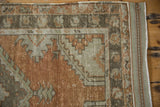 Vintage Distressed Oushak rug's side cord selvage, geometric border, terracotta, oxidized silver.
