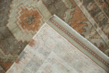 Distressed Oushak rug's worn pile, exposed foundation, and tight hand-knotted backing.