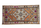 Vintage Distressed Oushak rug runner with burnt orange medallion, pale purple and fuchsia florals, 2'6