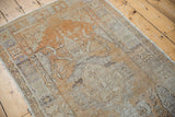 Distressed Oushak rug runner with worn knot heads, faint foundation, and original selvage.