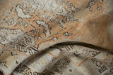 Distressed Oushak rug texture, revealing even wear with faint foundation and faded patterns.