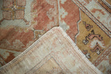 Distressed Oushak rug pile in copper and pale slate, showing worn texture and foundation.