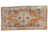 Vintage distressed Oushak runner, copper and silver diamond floral medallion.