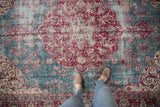The beautifully distressed surface of a vintage Sivas carpet, seen from a standing perspective.