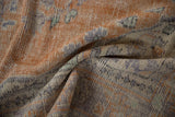 Faded terracotta orange and royal blue distressed pile with visible worn knot heads.