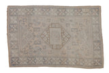 Vintage distressed Melas rug, muted ivory, beige, slate floral patterns. 3'11