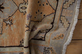 Distressed vintage Oushak rug showing abrashed field, wear to knot heads, pale rust, and fringe.