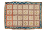 Distressed vintage Oushak rug with multi-paneled tree-of-life design in ivory, terracotta, indigo.