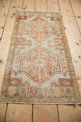 Distressed vintage Oushak rug texture with brick red, ivory geometric patterns and foundation wear.