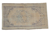 Decorative distressed Oushak rug, ivory field with faded blue roundel medallion and floral tendrils.