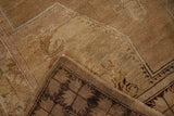Distressed Oushak rug showing textured pile and dark patterned reverse foundation.
