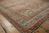 Vintage Distressed Oushak carpet with faded dusty rose and seafoam guls and wave border.