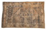 Worn vintage Melas rug, faded concentric floral medallions, gold, beige, charcoal tones, 2'11