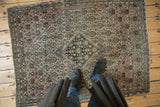 Antique Farahan Sarouk rug, navy diamond medallion, arrowed finials, and blossomed henna plant field.