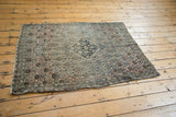 Antique Farahan Sarouk rug corner, showing tatter to sides and distressed edge with floral motif.