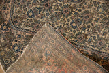 Antique Farahan Sarouk rug showing fine hand-knotted foundation and distressed tattered edge.