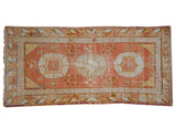 Vintage Khotan runner with triple pomegranate medallions, floral motifs, wave borders, pale terracotta, ivory.