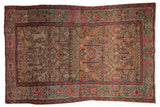 Antique Farahan Sarouk rug with allover tree-of-life vinery on a gold ground and a rare copper green border.