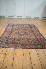 Low angle view of the antique Farahan Sarouk, showing its traditional layout and full length.