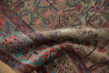 The supple texture of a collector Farahan Sarouk with its gold ground and rare copper-green border.