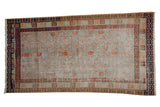 Distressed vintage Khotan rug, slate blue field, allover terracotta pomegranate lattice design.