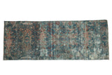 Distressed vintage Persian Mahal runner with allover floral pattern in blue, red, and ivory.