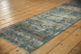 Distressed vintage Mahal runner, worn pile revealing foundation, blues, reds, and secure side.