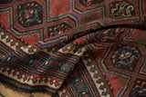 Antique Caucasian runner's fringe and geometric border featuring red, green, and ivory pawn motif.