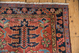 Antique Heriz rug corner, showing restored outer minor border, original side selvage and ivory fringe.