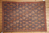 Hand knotted Persian Afshar rug: indigo lattice, brick red, saffron, gold boteh motifs.