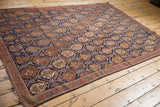 Antique Afshar rug with indigo blue and brick red boteh motifs in lattice panels.
