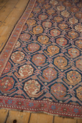 Antique Afshar rug: brick red outer border, light blue floral vines, indigo field.