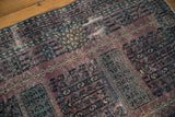 Distressed vintage Turkmen rug pile, showcasing an inseamed patch and geometric patterns.