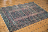Worn pile and geometric patterns in aubergine and charcoal on this vintage Turkmen rug.