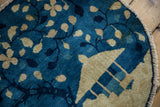 Beige gazebo on antique Peking pictorial rug, cobalt blue landscape, worn fringe.
