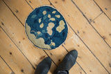 Hand-knotted antique Peking pictorial rug detail: expressive beige leaves, indigo field, original worn edge.