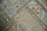 Hand-knotted construction of a vintage Oushak rug, showing textured pile and intact selvage.