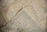 Vintage distressed Sivas carpet, reverse side highlighting tight knotting and visible navy pattern.