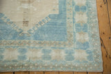 Distressed Oushak rug, powder blue and ivory geometric border, short pile, original selvage.
