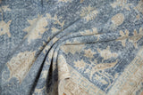 Visible foundation through allover distressed sky blue and beige vintage Sparta rug.